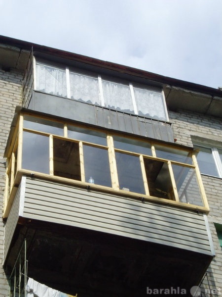 Предложение: остекление деревянными рамами балконов